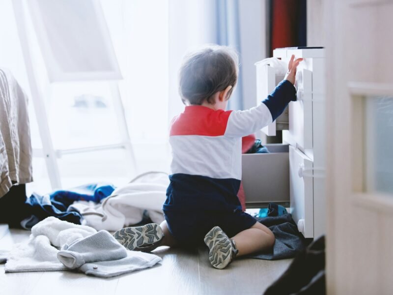 child makes a mess in the closet